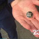 Matt McFarland holds the pin he has been told he cannot wear on his uniform (KRCR screenshot)
